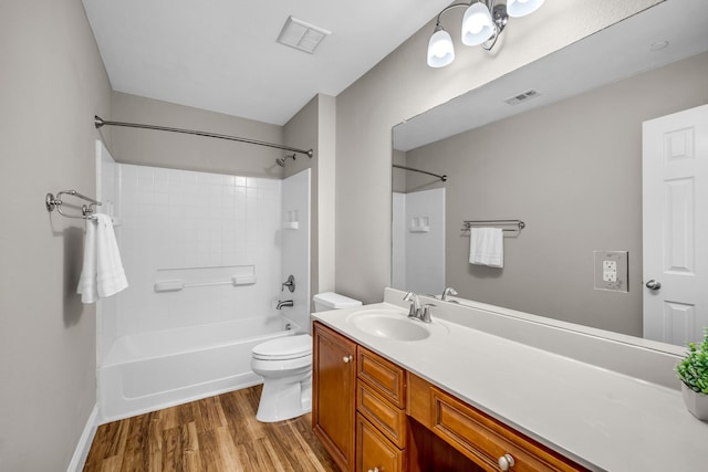6224 Madrone Ct, Plano, TX 75074 - bathroom featuring wood finished floors, toilet, washtub / shower combination, and vanity