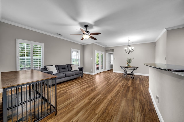 6224 Madrone Ct, Plano, TX 75074 - living area featuring wood finished floors, a ceiling fan, baseboards, a chandelier, and crown molding
