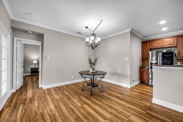 6224 Madrone Ct, Plano, TX 75074 - unfurnished dining area with wood finished floors, crown molding, baseboards, a chandelier, and recessed lighting