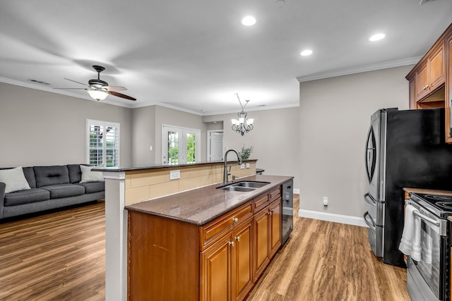 6224 Madrone Ct, Plano, TX 75074 - kitchen with a sink, stainless steel electric range, dishwasher, light wood finished floors, and brown cabinetry