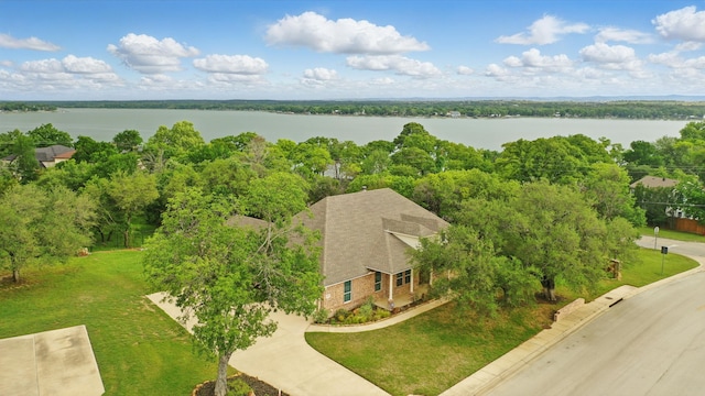 birds eye view of property with a water view
