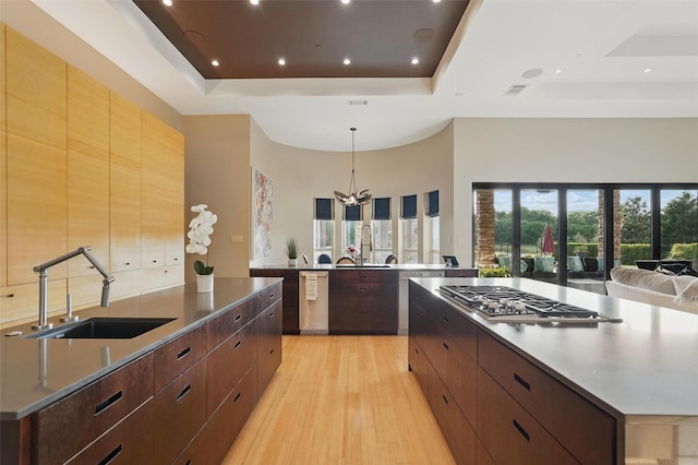 25 White Rock Trl, Lucas, TX 75002 - kitchen with a large island, stainless steel appliances, a tray ceiling, and a sink