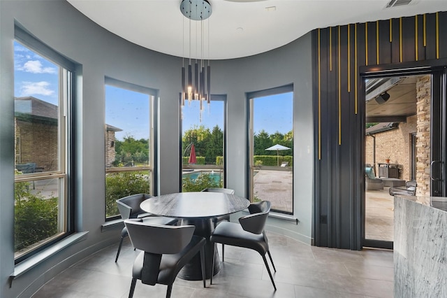 25 White Rock Trl, Lucas, TX 75002 - dining area featuring tile patterned floors, a wealth of natural light, visible vents, and baseboards