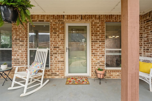 entrance to property with brick siding