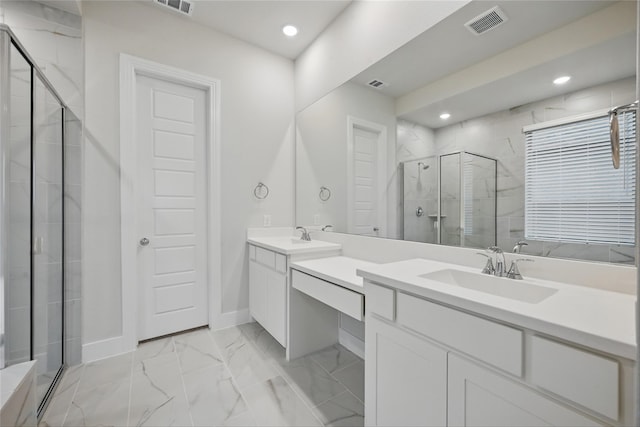 bathroom featuring marble finish floor, vanity, visible vents, a stall shower, and baseboards