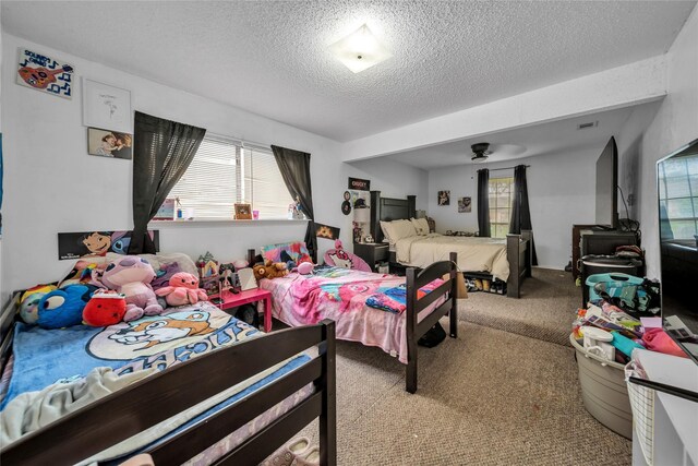 carpeted bedroom featuring a textured ceiling