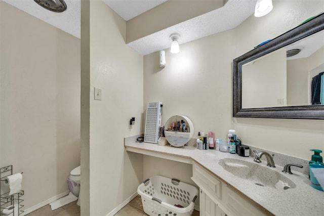 bathroom with toilet, visible vents, tile patterned flooring, and vanity