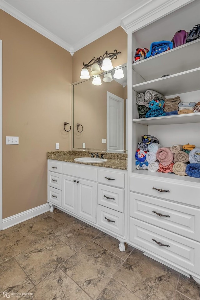 230 Welham Trce, Bossier City, LA 71112 - bathroom featuring stone finish flooring, baseboards, vanity, and ornamental molding