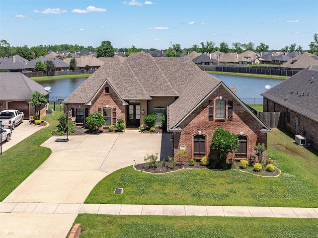 230 Welham Trce, Bossier City, LA 71112 - view of front of house with a water view, brick siding, and a residential view
