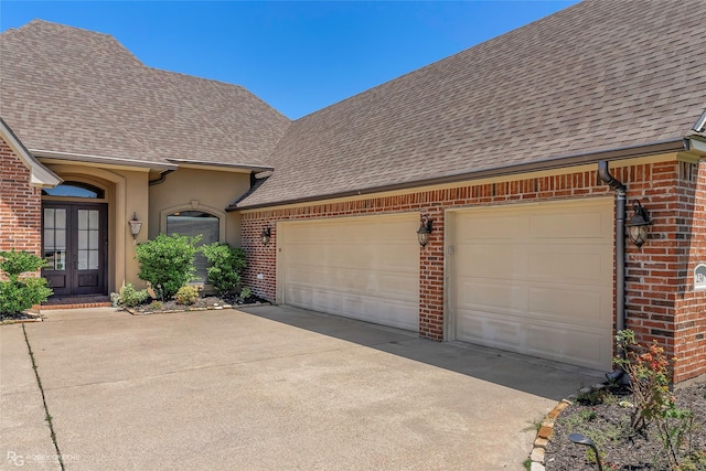230 Welham Trce, Bossier City, LA 71112 - view of front of property featuring roof with shingles, concrete driveway, french doors, and brick siding