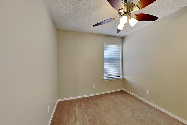 empty room featuring carpet flooring, a textured ceiling, baseboards, and a ceiling fan
