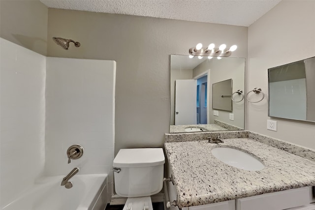 full bath with shower / bath combination, vanity, a textured ceiling, and toilet