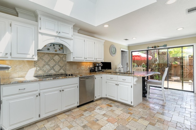 2204 Bridge View Ln, Plano, TX 75093 - kitchen featuring stainless steel dishwasher, a peninsula, crown molding, stone tile flooring, and white cabinetry