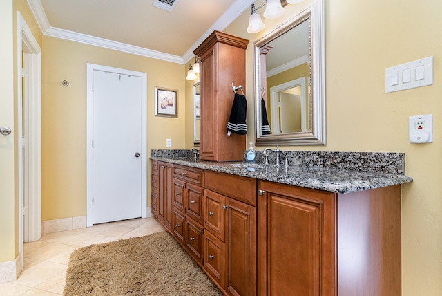 2204 Bridge View Ln, Plano, TX 75093 - bathroom with crown molding, tile patterned flooring, double vanity, and baseboards