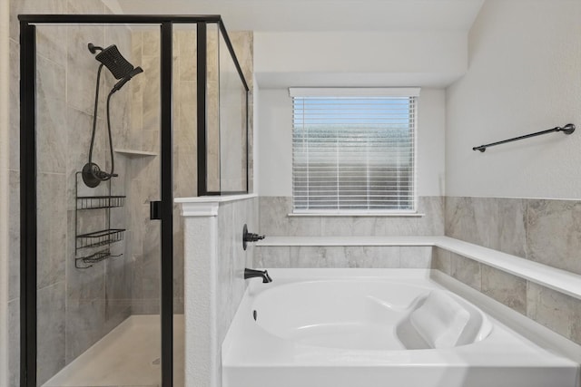 full bath with a shower stall and a bath