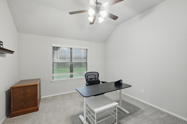 carpeted home office with vaulted ceiling, baseboards, and a ceiling fan