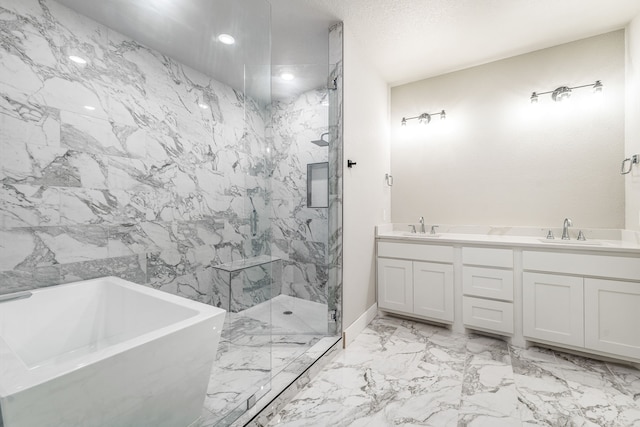 1007 Westwood, Graham, TX 76450 - bathroom with a marble finish shower, marble finish floor, a freestanding tub, and a sink