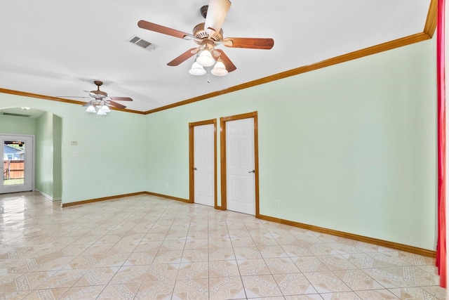 908 E Belknap St, Ennis, TX 75119 - unfurnished room with arched walkways, ceiling fan, crown molding, and baseboards