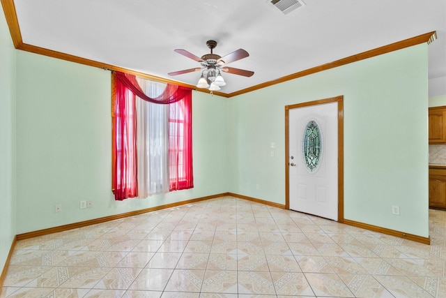 908 E Belknap St, Ennis, TX 75119 - spare room with crown molding, ceiling fan, baseboards, and light tile patterned floors