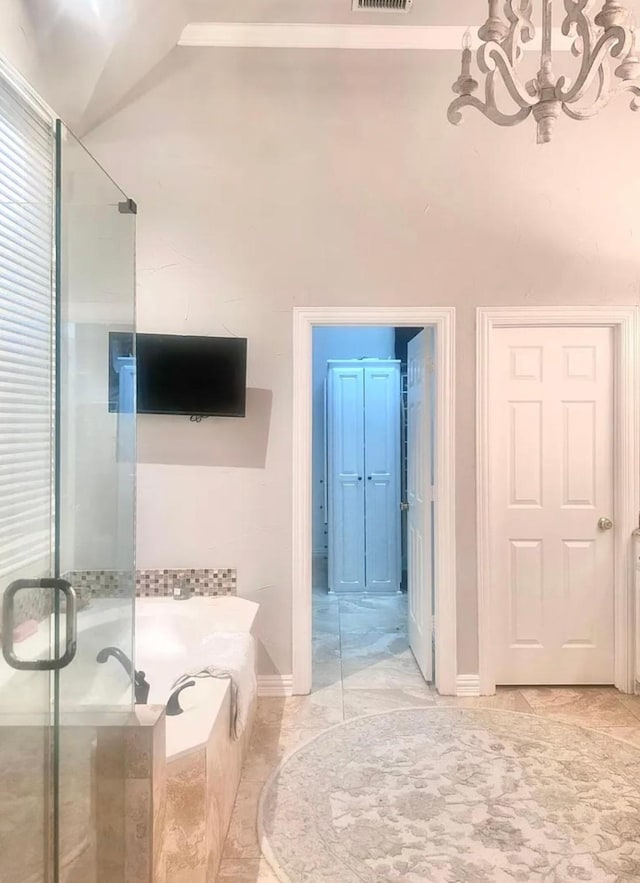 8004 Ashby Ct, Plano, TX 75025 - bathroom featuring a stall shower, a chandelier, a bath, and baseboards