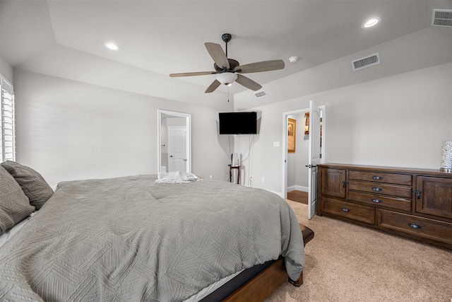 bedroom with light colored carpet, visible vents, and recessed lighting
