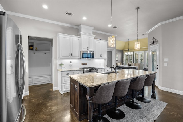 kitchen featuring a sink, concrete flooring, visible vents, and appliances with stainless steel finishes