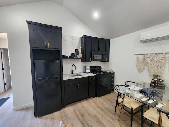 kitchen featuring lofted ceiling, a sink, open shelves, backsplash, and black appliances