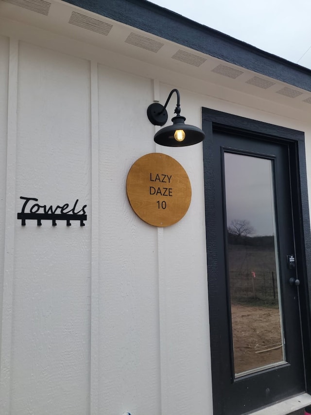 property entrance with visible vents