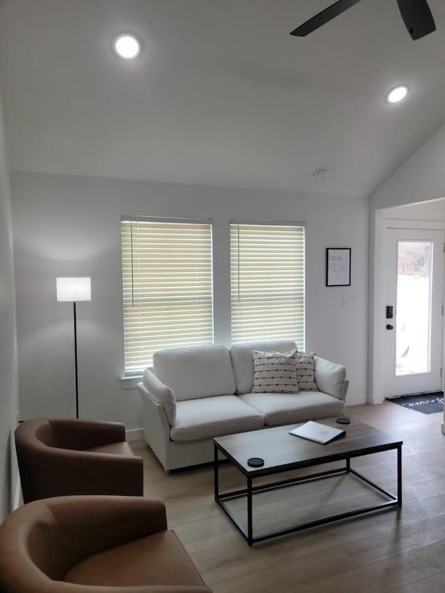 living area with ceiling fan, light wood-style flooring, lofted ceiling, and recessed lighting