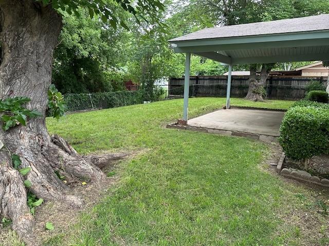 view of yard featuring a fenced backyard and a patio area