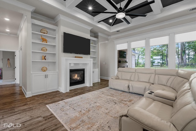 living area featuring baseboards, a healthy amount of sunlight, crown molding, and dark wood-style floors