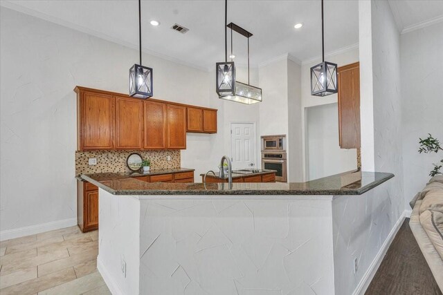 188 Jordan Ct, Lucas, TX 75002 - kitchen with appliances with stainless steel finishes, brown cabinetry, dark stone counters, tasteful backsplash, and ornamental molding