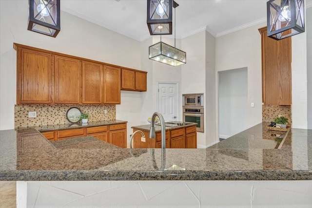 188 Jordan Ct, Lucas, TX 75002 - kitchen with appliances with stainless steel finishes, brown cabinets, dark stone countertops, backsplash, and crown molding