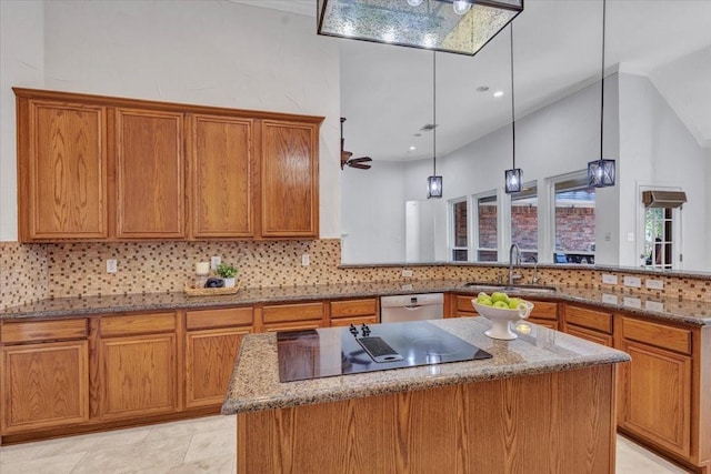 188 Jordan Ct, Lucas, TX 75002 - kitchen with a sink, black electric cooktop, dishwashing machine, a kitchen island, and brown cabinetry