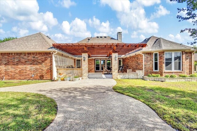 188 Jordan Ct, Lucas, TX 75002 - view of front of house featuring brick siding, driveway, a chimney, and a front yard
