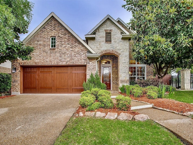 10853 Dixon Branch Dr, Dallas, TX 75218 - french country style house with brick siding, driveway, and stone siding