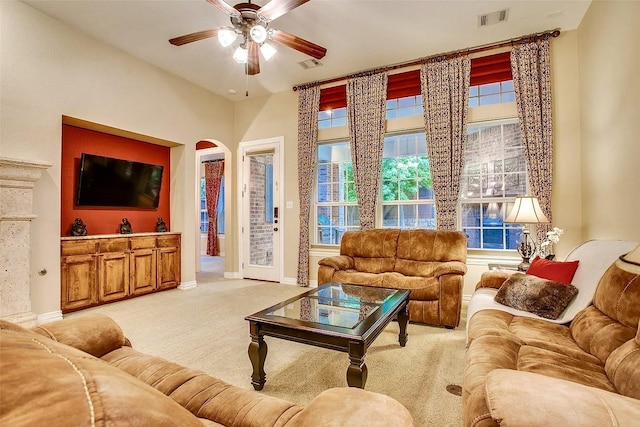 10853 Dixon Branch Dr, Dallas, TX 75218 - carpeted living room with ceiling fan, baseboards, and arched walkways