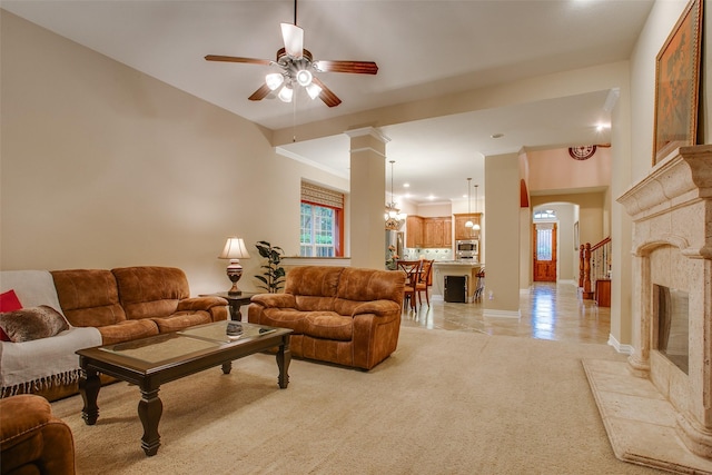 10853 Dixon Branch Dr, Dallas, TX 75218 - living room with baseboards, a ceiling fan, ornate columns, and arched walkways