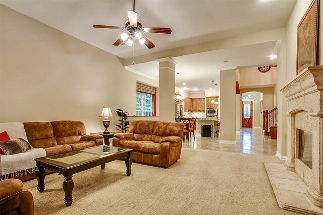 10853 Dixon Branch Dr, Dallas, TX 75218 - living area with a ceiling fan, arched walkways, ornate columns, and baseboards