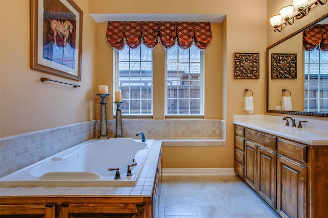 10853 Dixon Branch Dr, Dallas, TX 75218 - bathroom featuring vanity, a garden tub, and baseboards