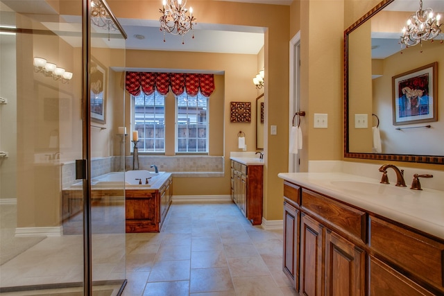 10853 Dixon Branch Dr, Dallas, TX 75218 - bathroom featuring a sink, a chandelier, two vanities, and a bath
