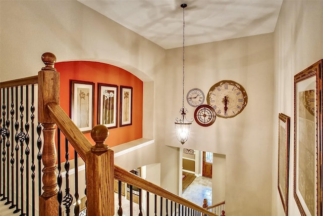 10853 Dixon Branch Dr, Dallas, TX 75218 - hall with arched walkways and an upstairs landing