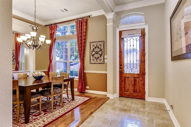 10853 Dixon Branch Dr, Dallas, TX 75218 - entrance foyer with crown molding, a chandelier, baseboards, and light stone finish flooring