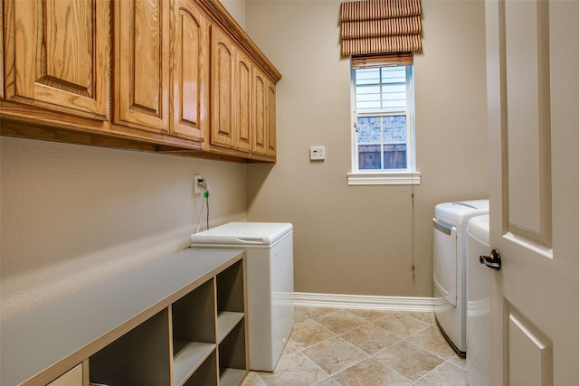 10853 Dixon Branch Dr, Dallas, TX 75218 - laundry room featuring cabinet space, washing machine and dryer, and baseboards
