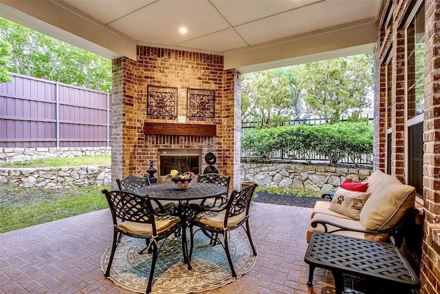 10853 Dixon Branch Dr, Dallas, TX 75218 - view of patio / terrace featuring an outdoor brick fireplace and outdoor dining space