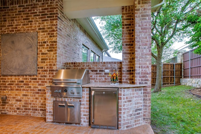 10853 Dixon Branch Dr, Dallas, TX 75218 - view of patio / terrace featuring exterior kitchen, fence, and grilling area