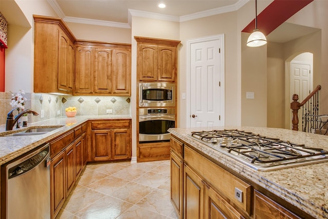 10853 Dixon Branch Dr, Dallas, TX 75218 - kitchen featuring a sink, stainless steel appliances, backsplash, and light stone counters