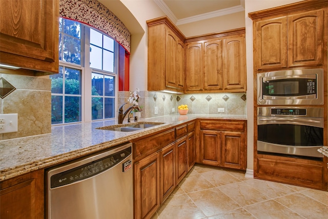 10853 Dixon Branch Dr, Dallas, TX 75218 - kitchen with a sink, stainless steel appliances, crown molding, light stone countertops, and backsplash
