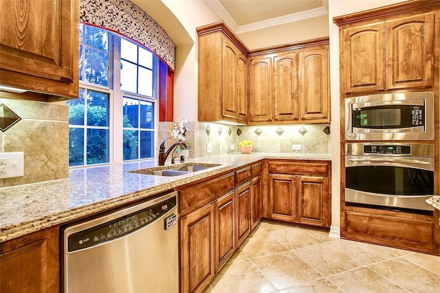10853 Dixon Branch Dr, Dallas, TX 75218 - kitchen featuring appliances with stainless steel finishes, a sink, light stone counters, decorative backsplash, and crown molding