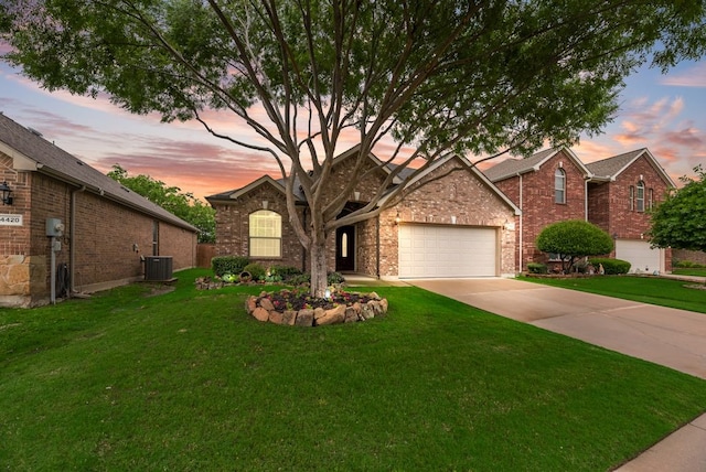 4416 Coney Island Dr, Frisco, TX 75036 - view of front of house featuring an attached garage, brick siding, concrete driveway, a front lawn, and central AC unit